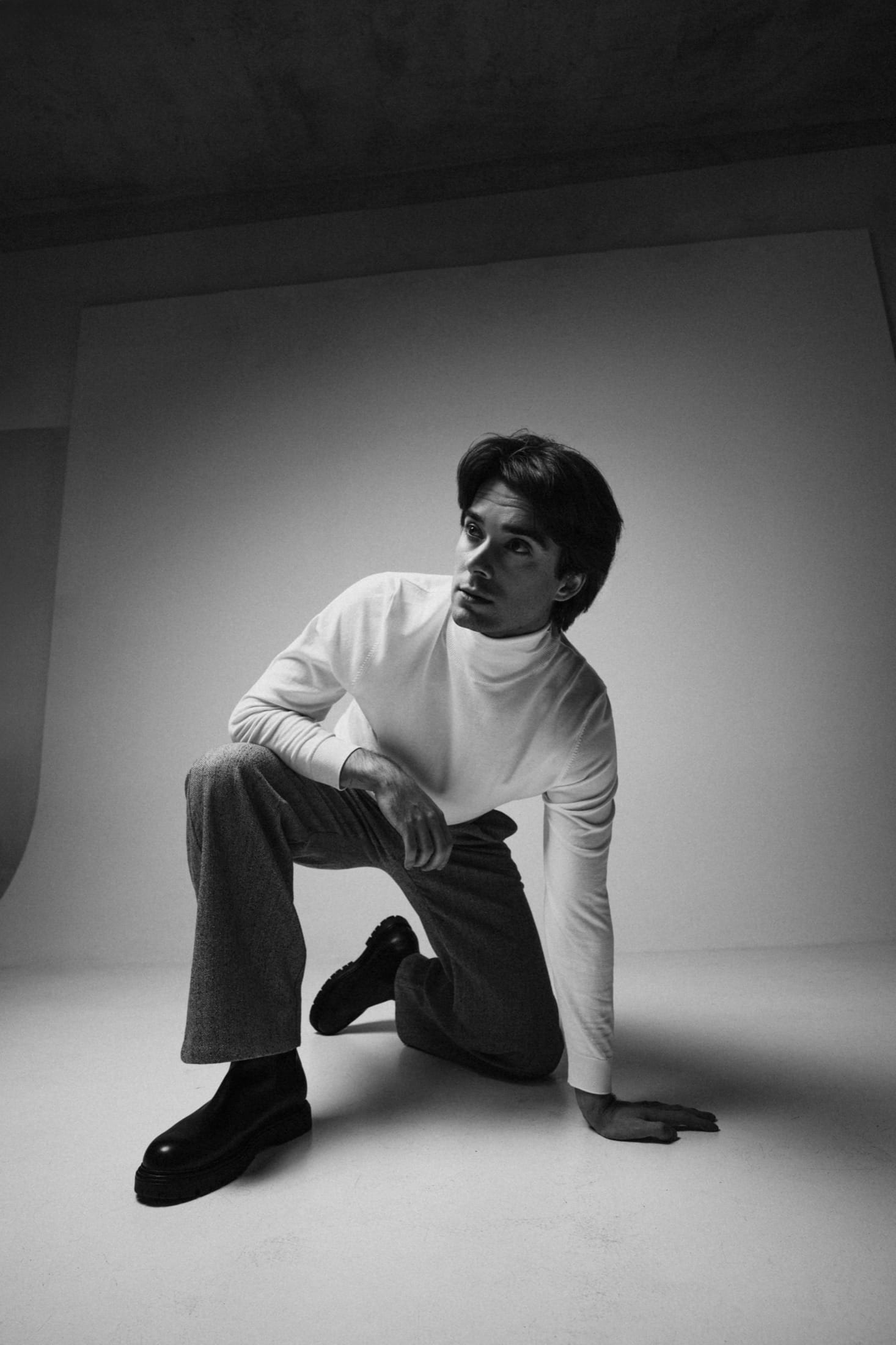 Full-length studio portrait, white shirt