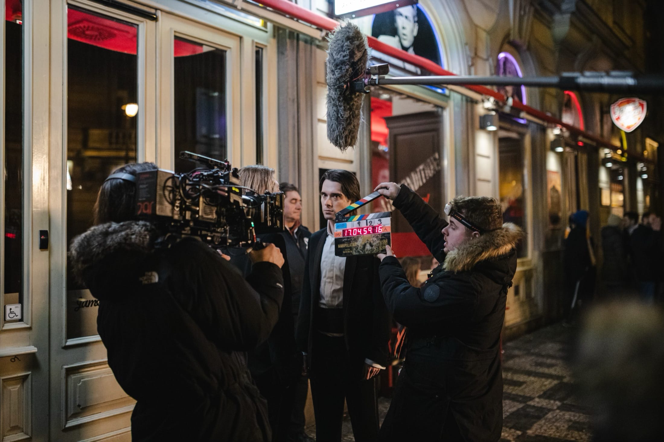 Vojtech Babista on the night set of Manipulation, camera crew around him