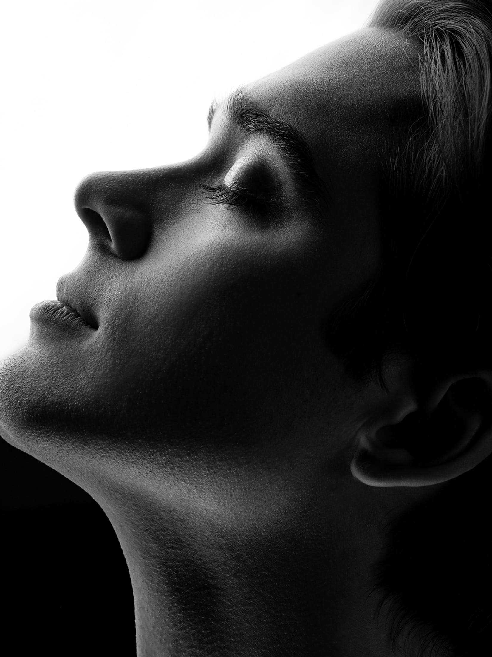 Black and white profile, head tilted back